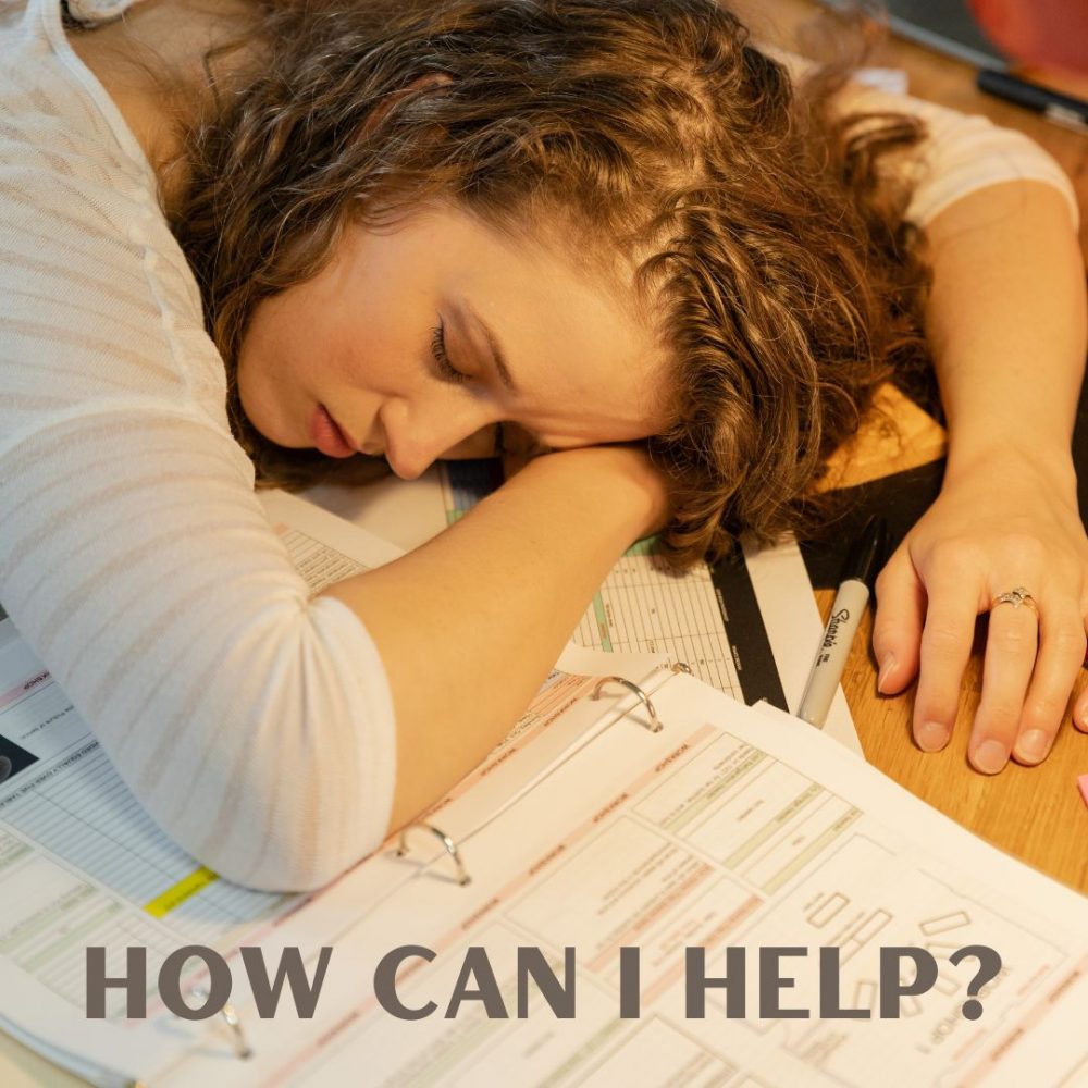Woman lying on work papers, exhausted with words How Can I Help?